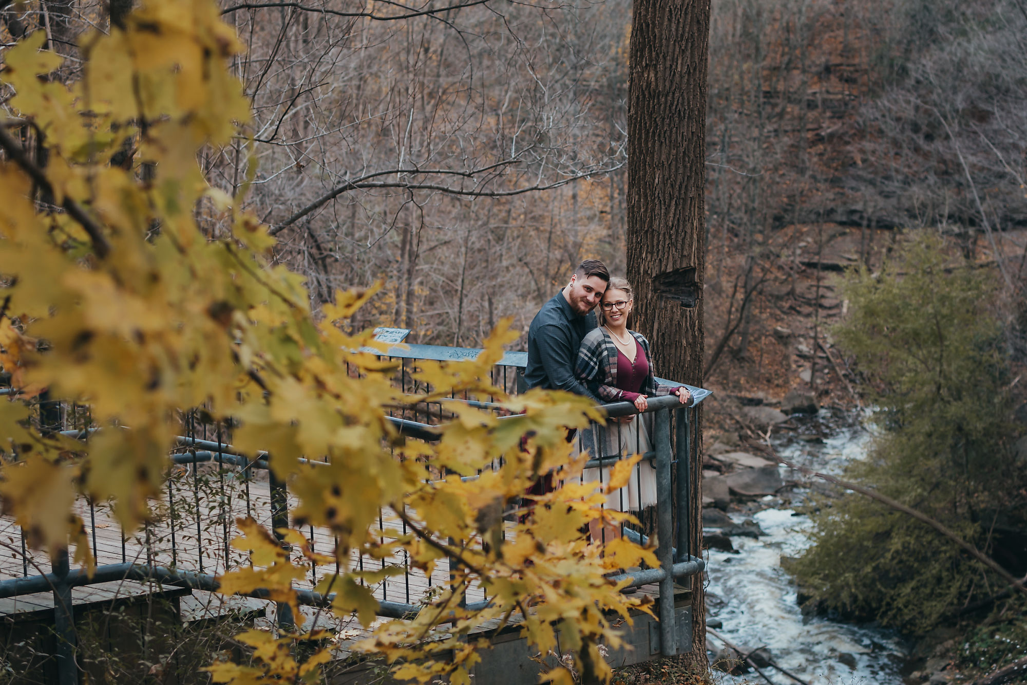 Dan and Nina pose at the lookout point by Smokey Hollow Falls during their engagement session in Dundas Ontario with photographer Jennifer Blaak.