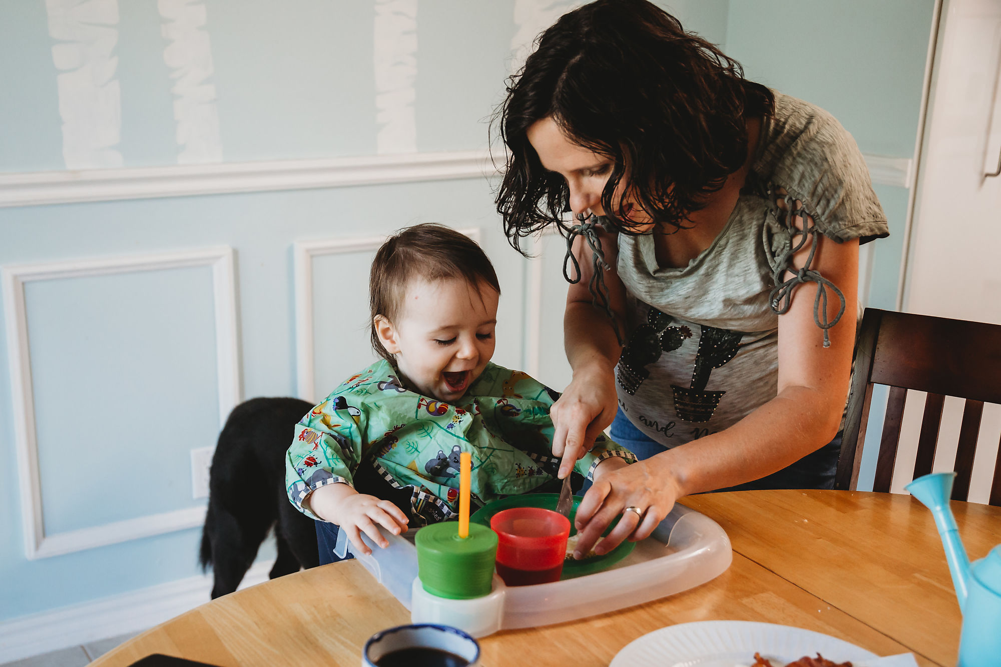 Documentary-style Dundas Maternity Photographer Jennifer Blaak captures snack-time during the families maternity and lifestyle shoot.