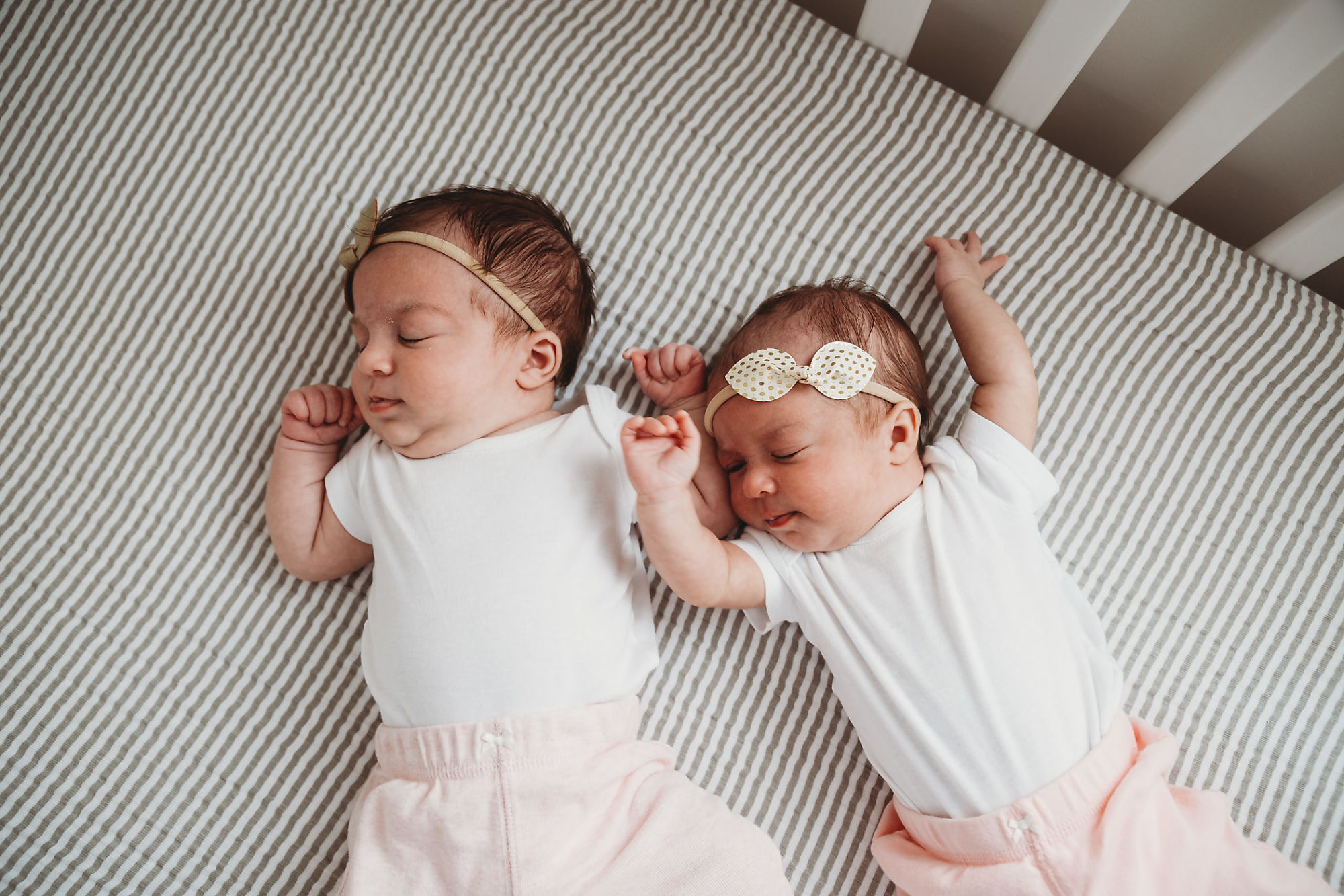 Lifestyle Hamilton Newborn Photographer Jennifer Blaak captures sleeping twins in their crib at home in Hamilton.