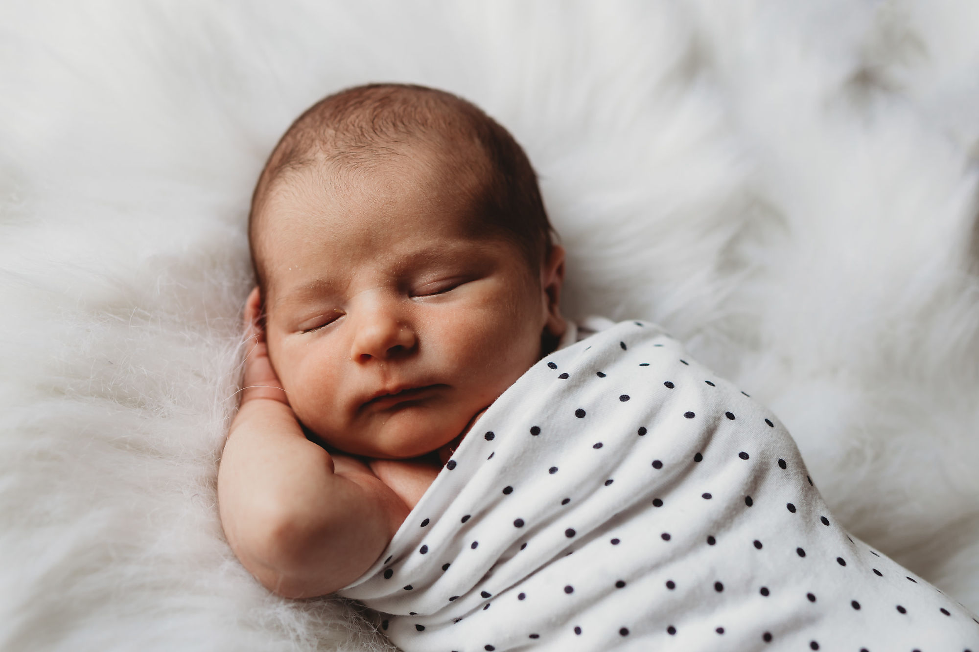 Dundas Newborn Photographer Jennifer Blaak photographs a peaceful moment for baby during their newborn and family lifestyle photography session at home in Hamilton.