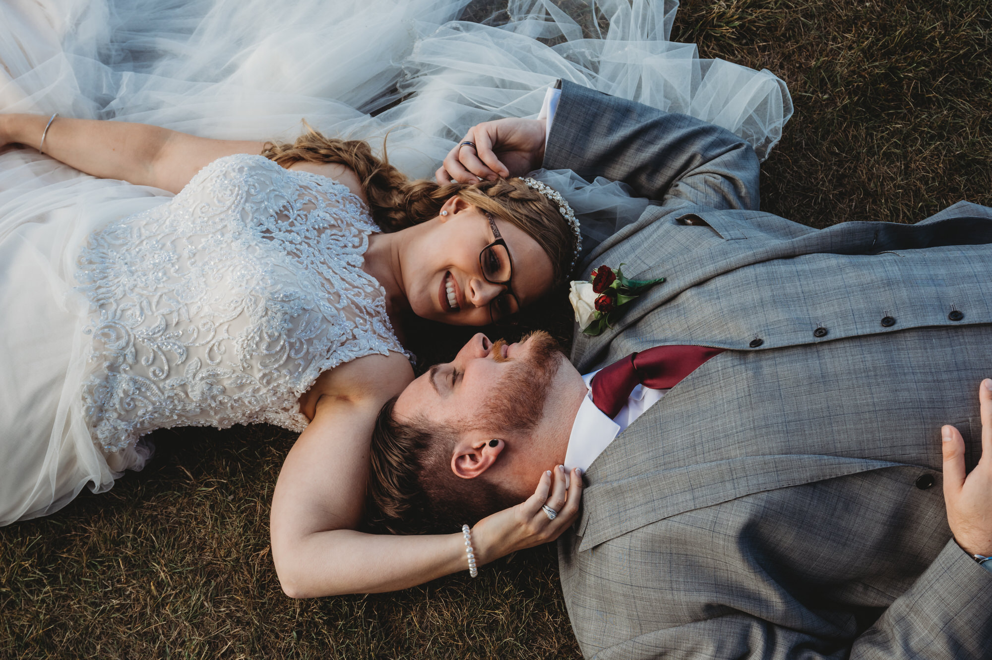 Stoney Creek Wedding Photographer Jennifer Blaak - Bride and groom laying in the grass
