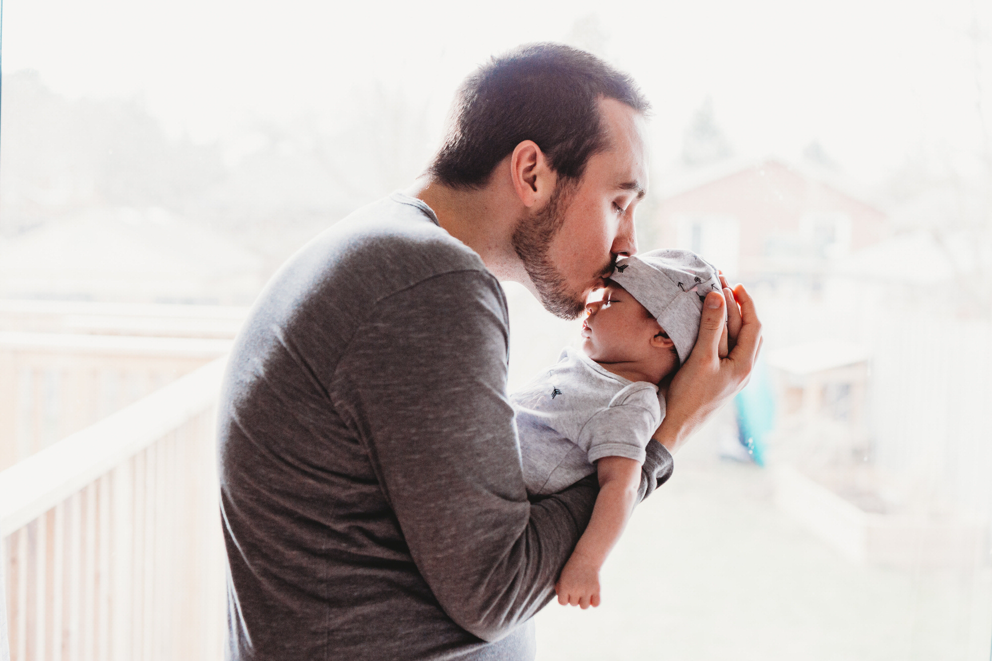 Tillsonburg newborn Photographer - father kissing baby